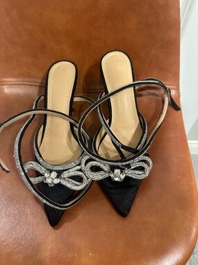 Black satin strappy heel with rhinestoned bow